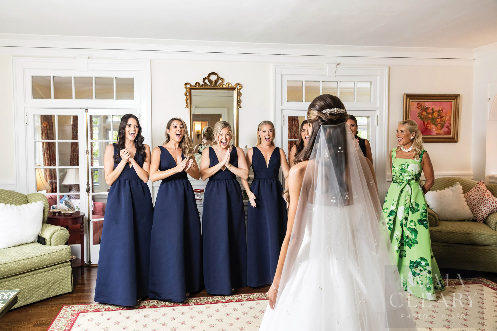 Bridesmades are surprised by the bride