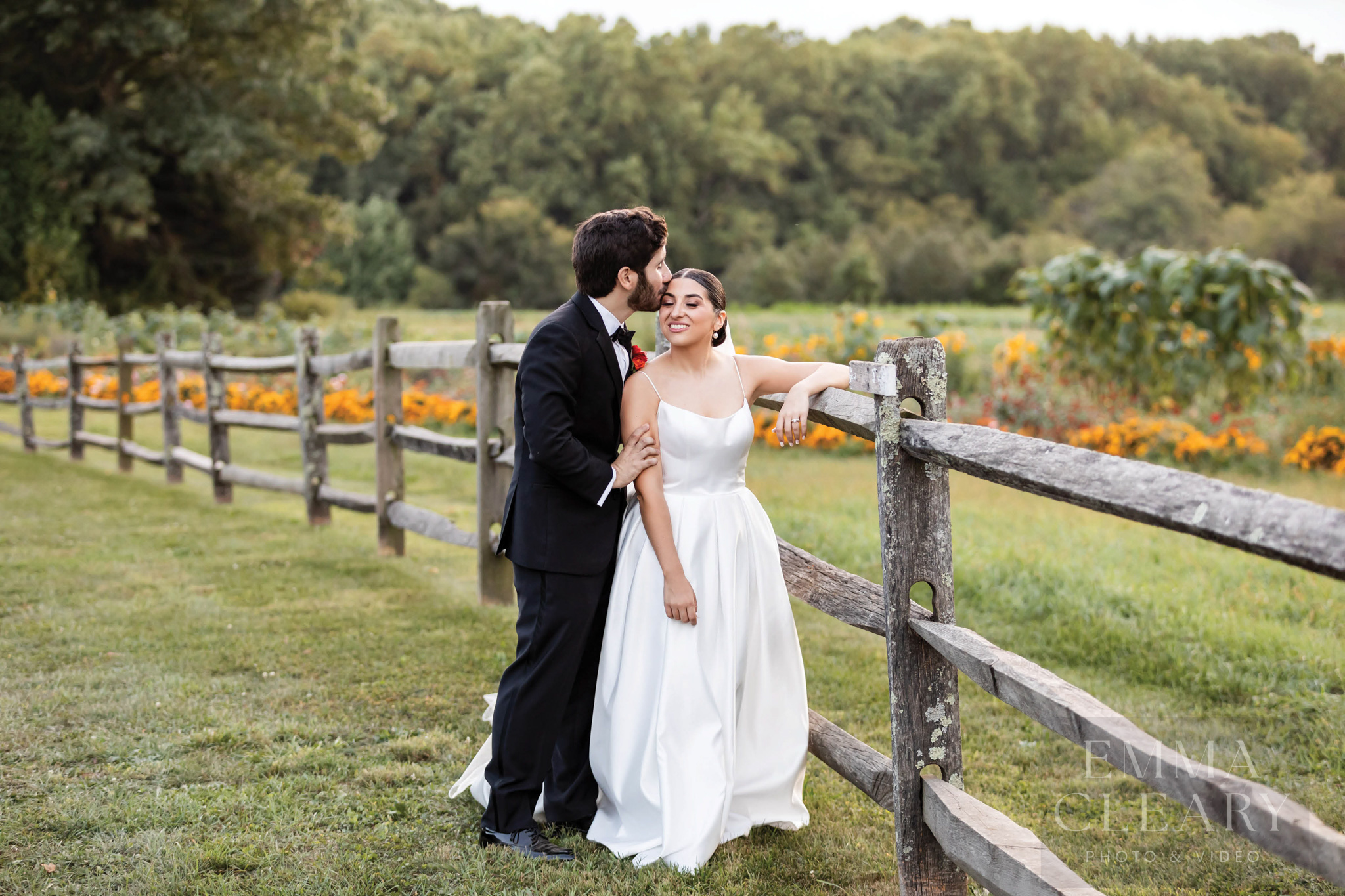 The groom kisses the bride