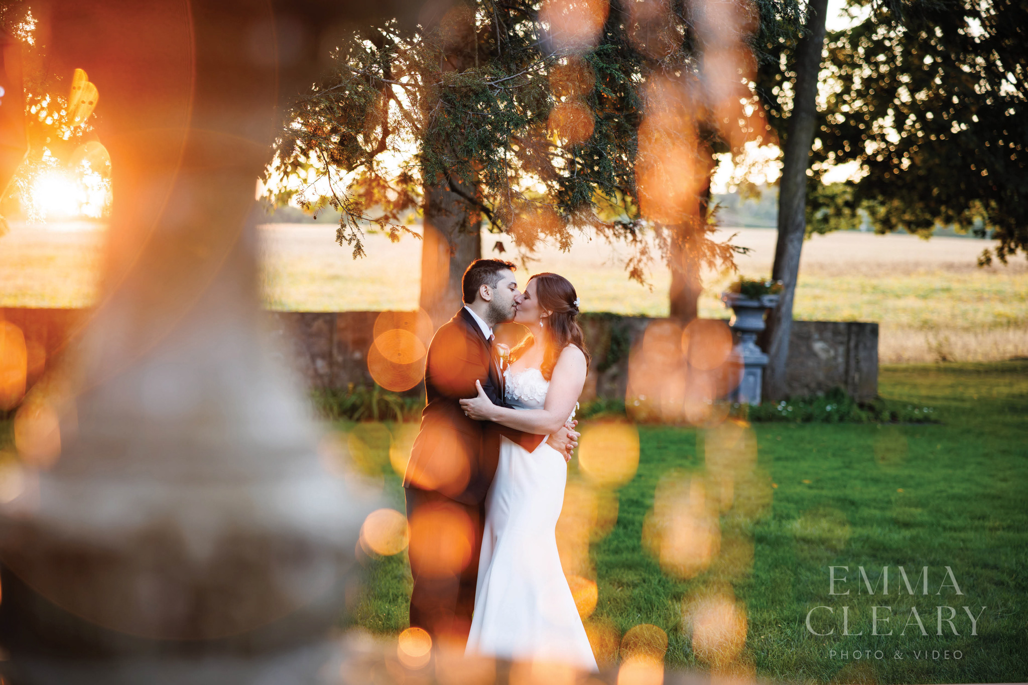 Sunset wedding kiss