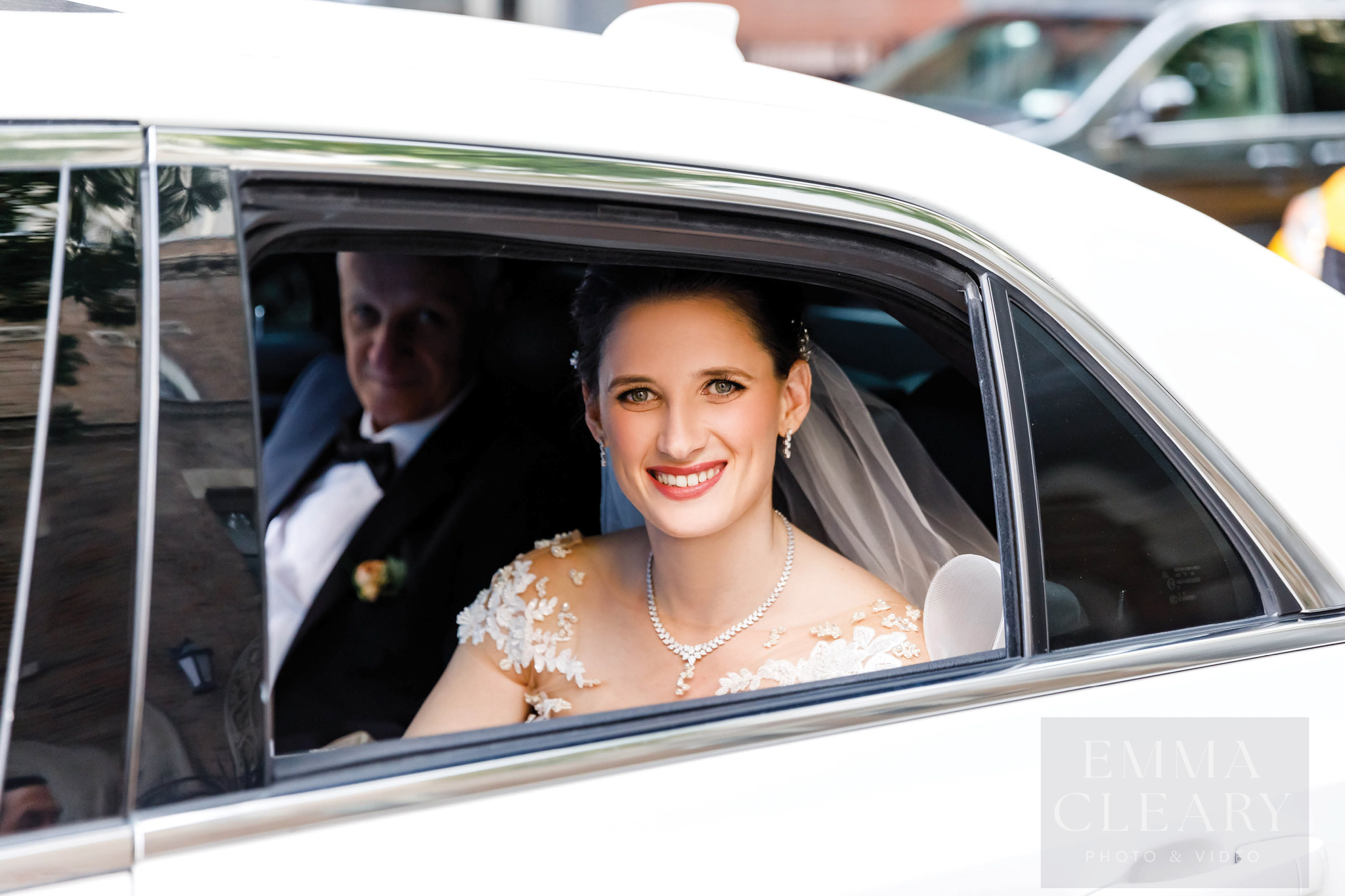 Photo of the bride in the wedding car
