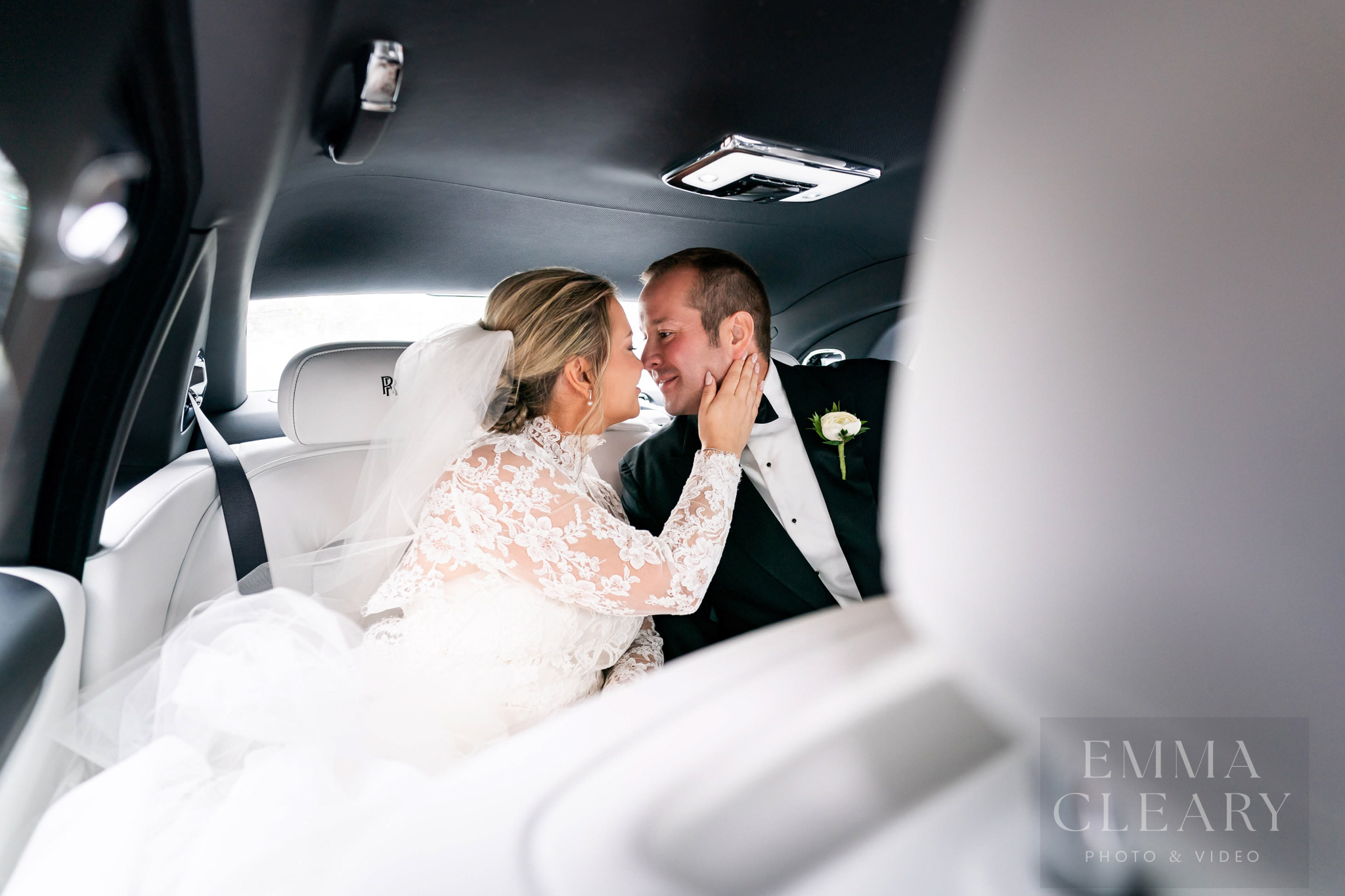 Portrait of a couple in a wedding car