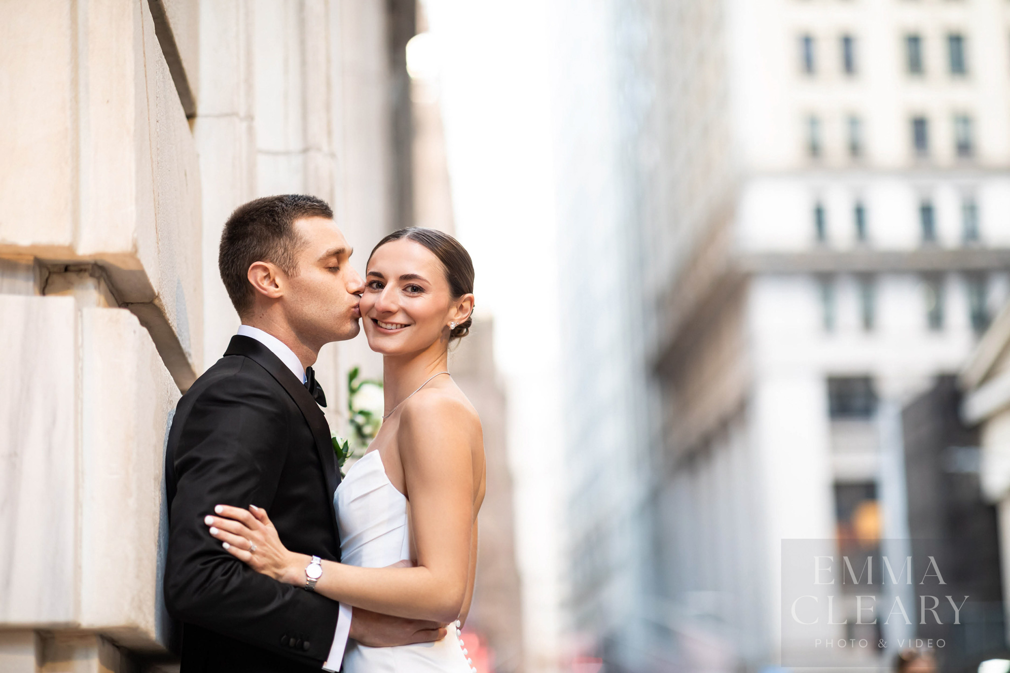 The groom kisses the bride