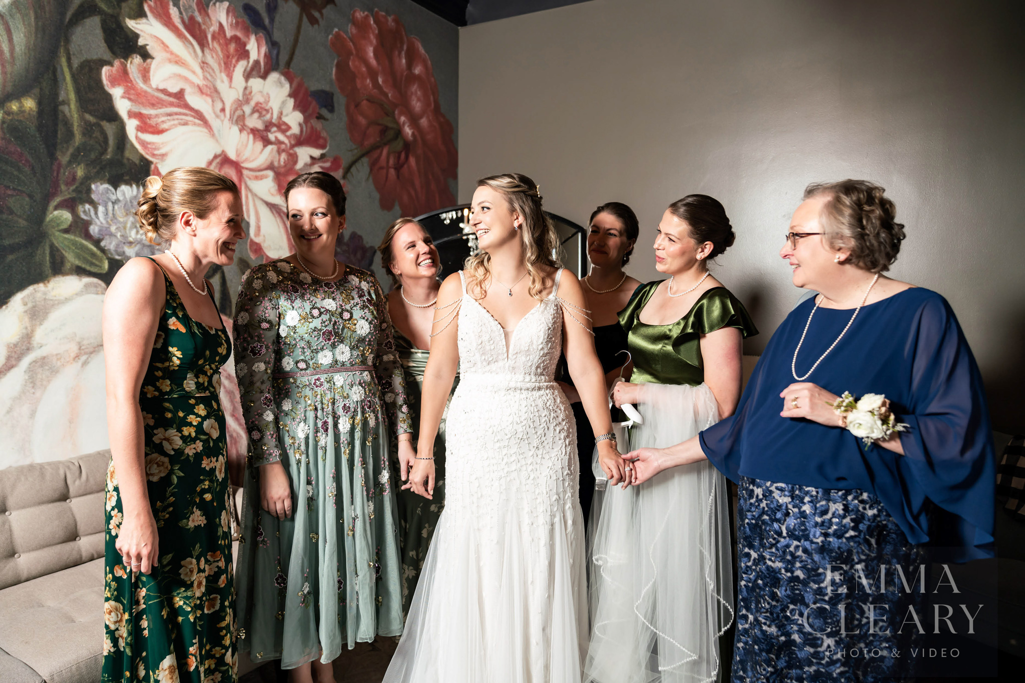 Bride and bridesmaids and mom