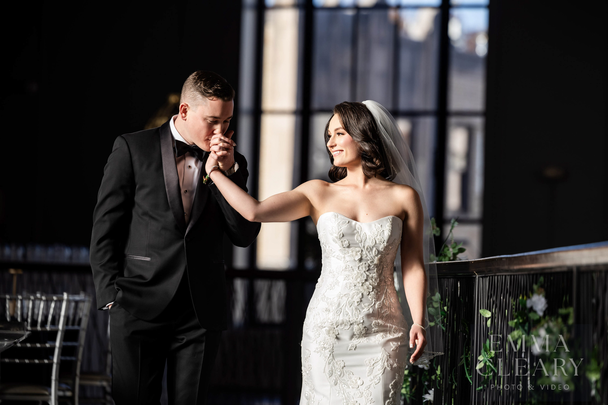 The groom kisses the bride's hand
