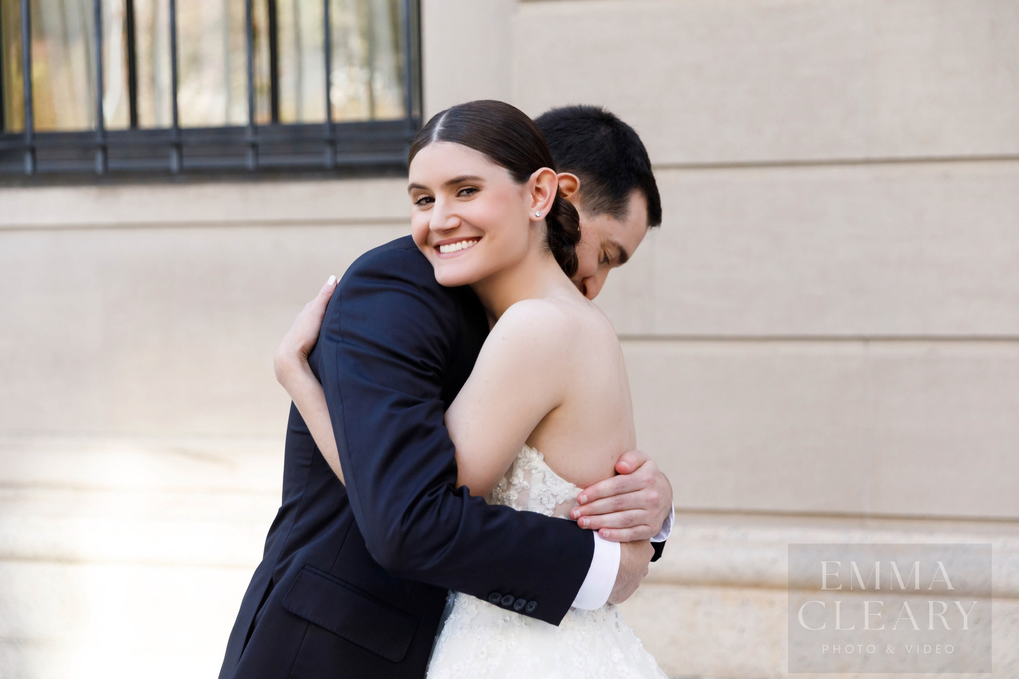 The bride and groom embrace