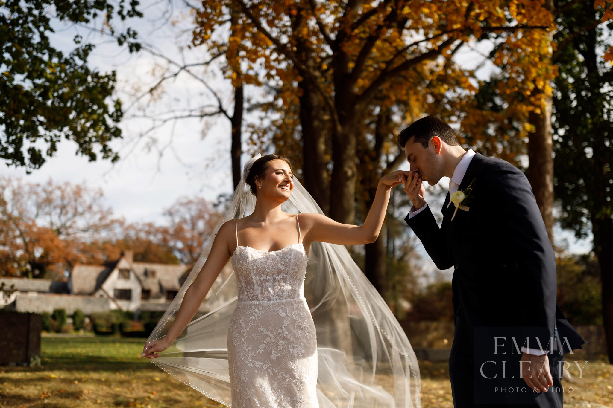 The groom kisses the bride's hand