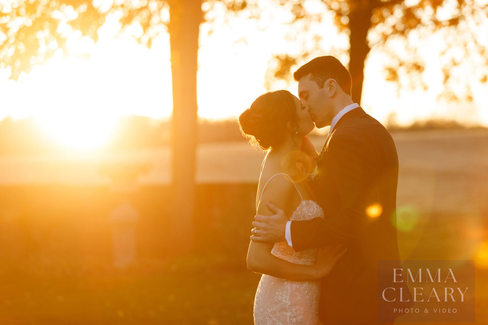 Sunset wedding kiss