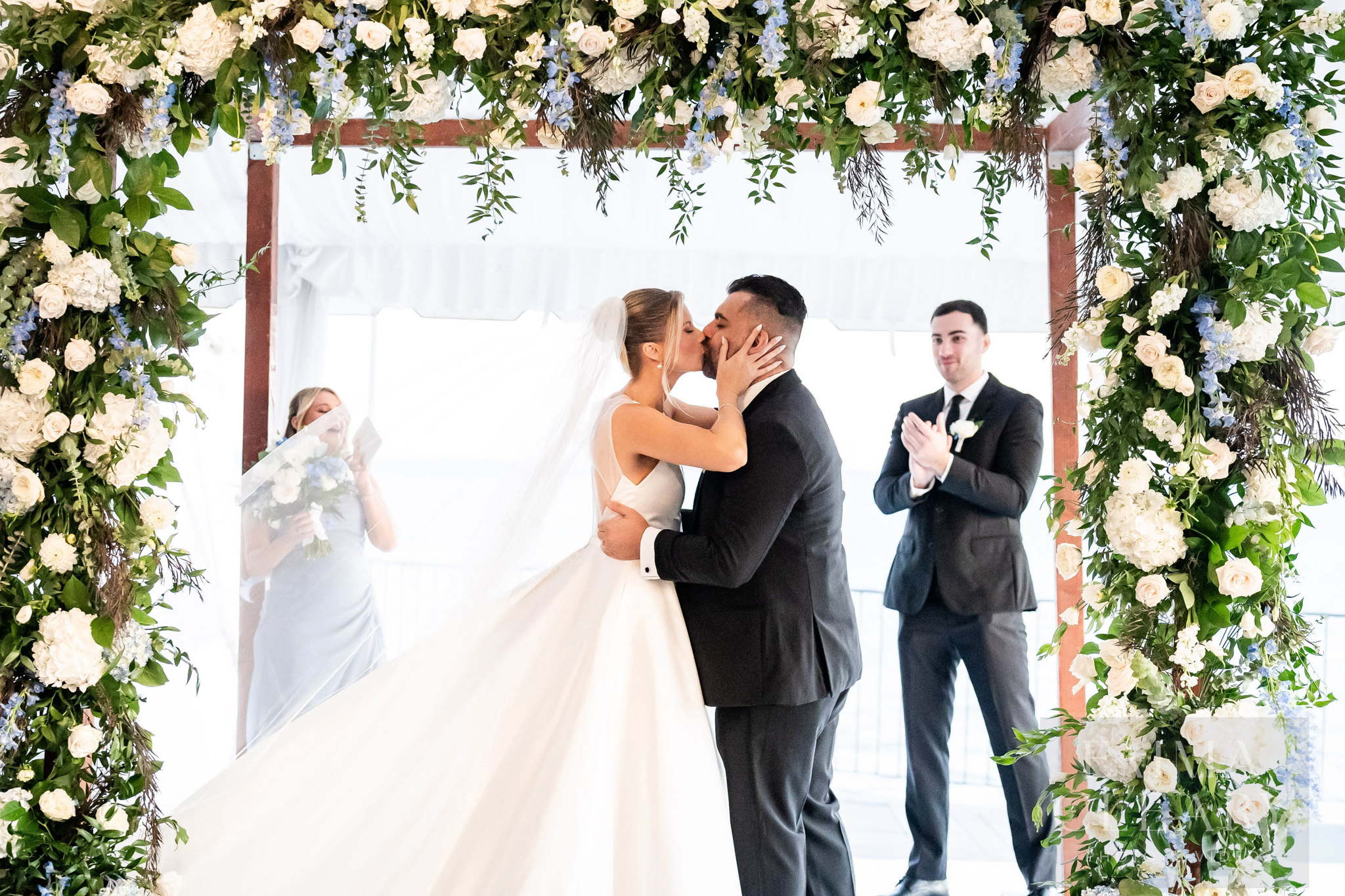 Wedding photo of a couple kissing