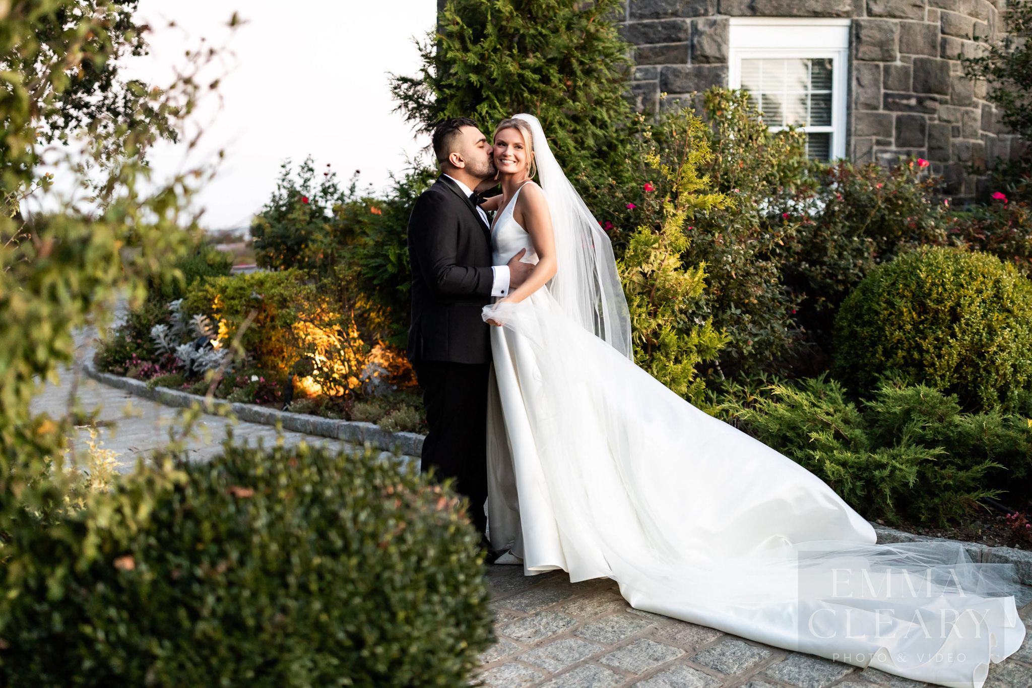 The groom kisses the bride