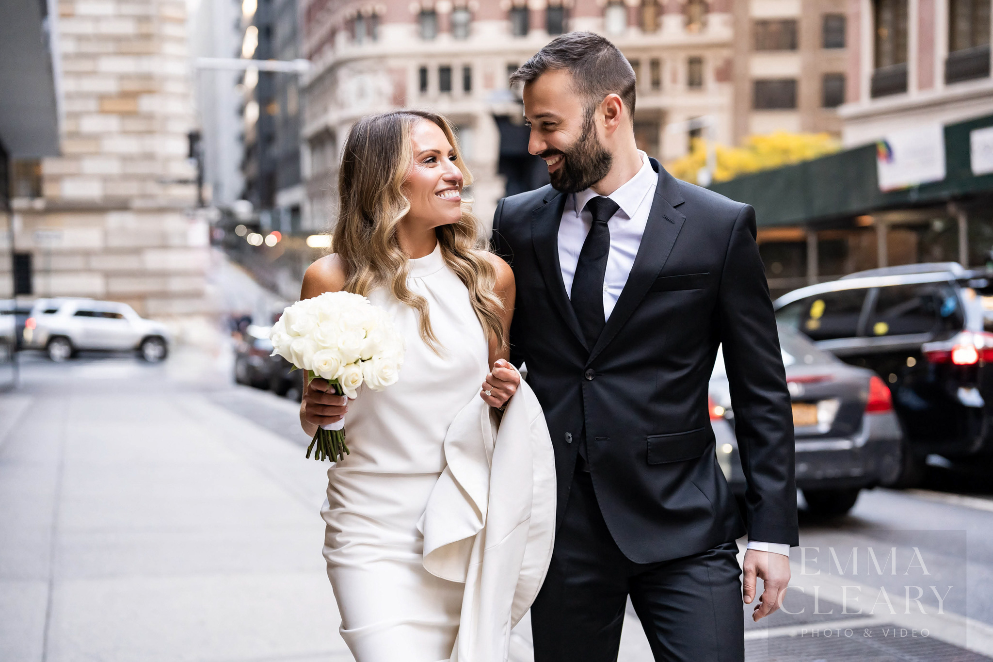 The bride and groom are walking