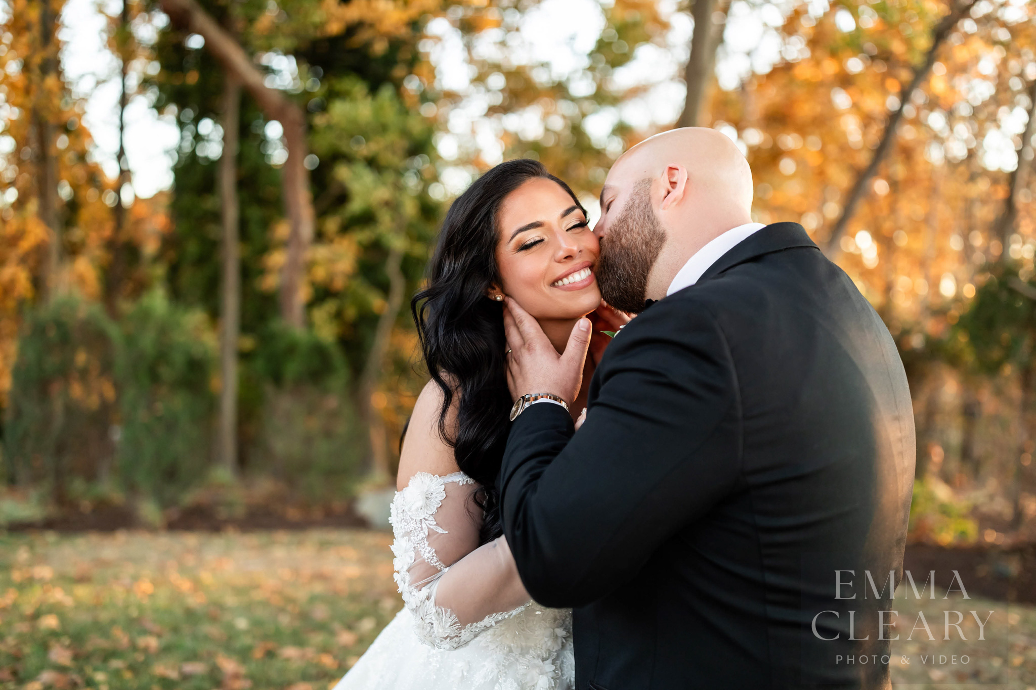 The groom kisses the bride