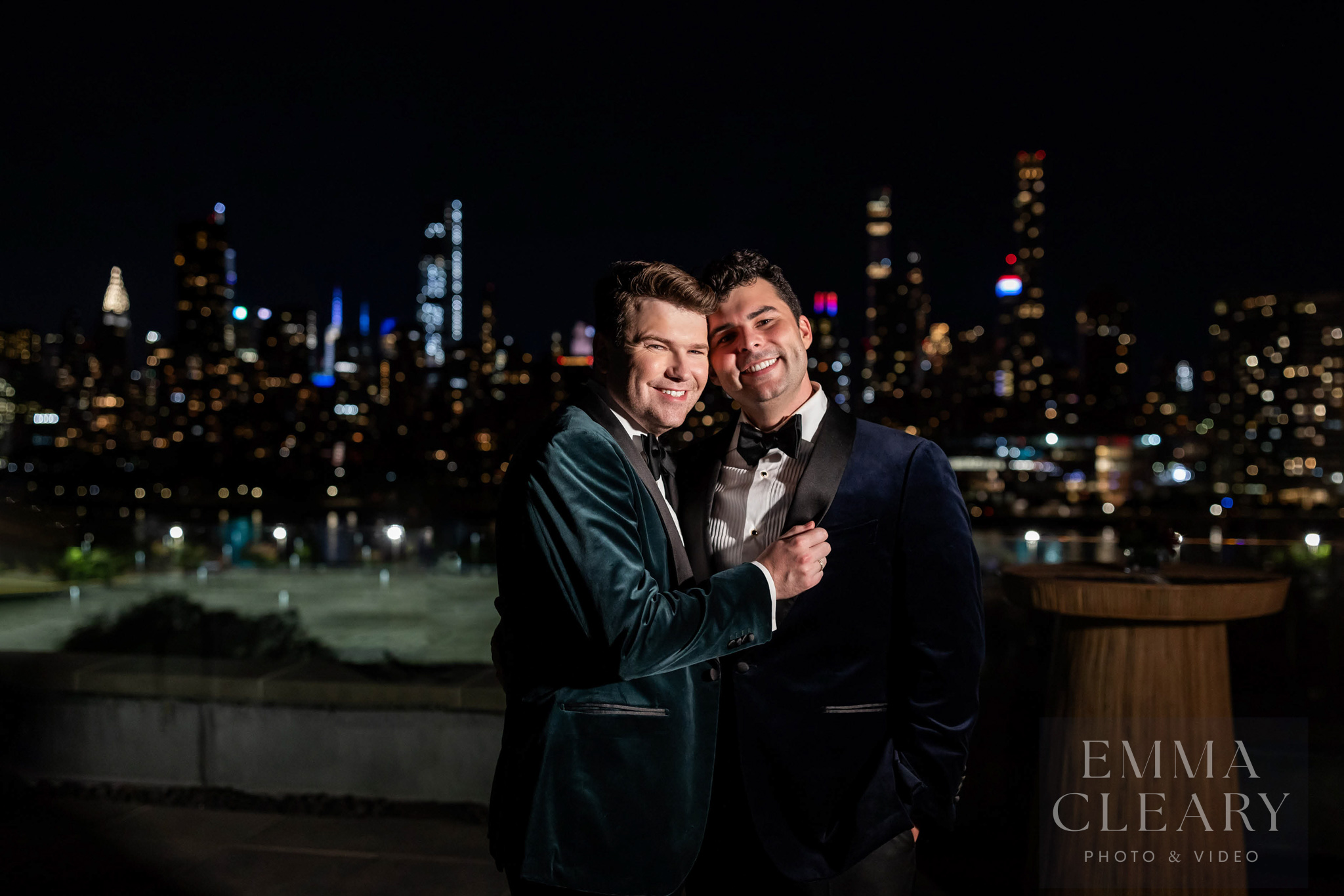 Photo of a couple with a view of the night city