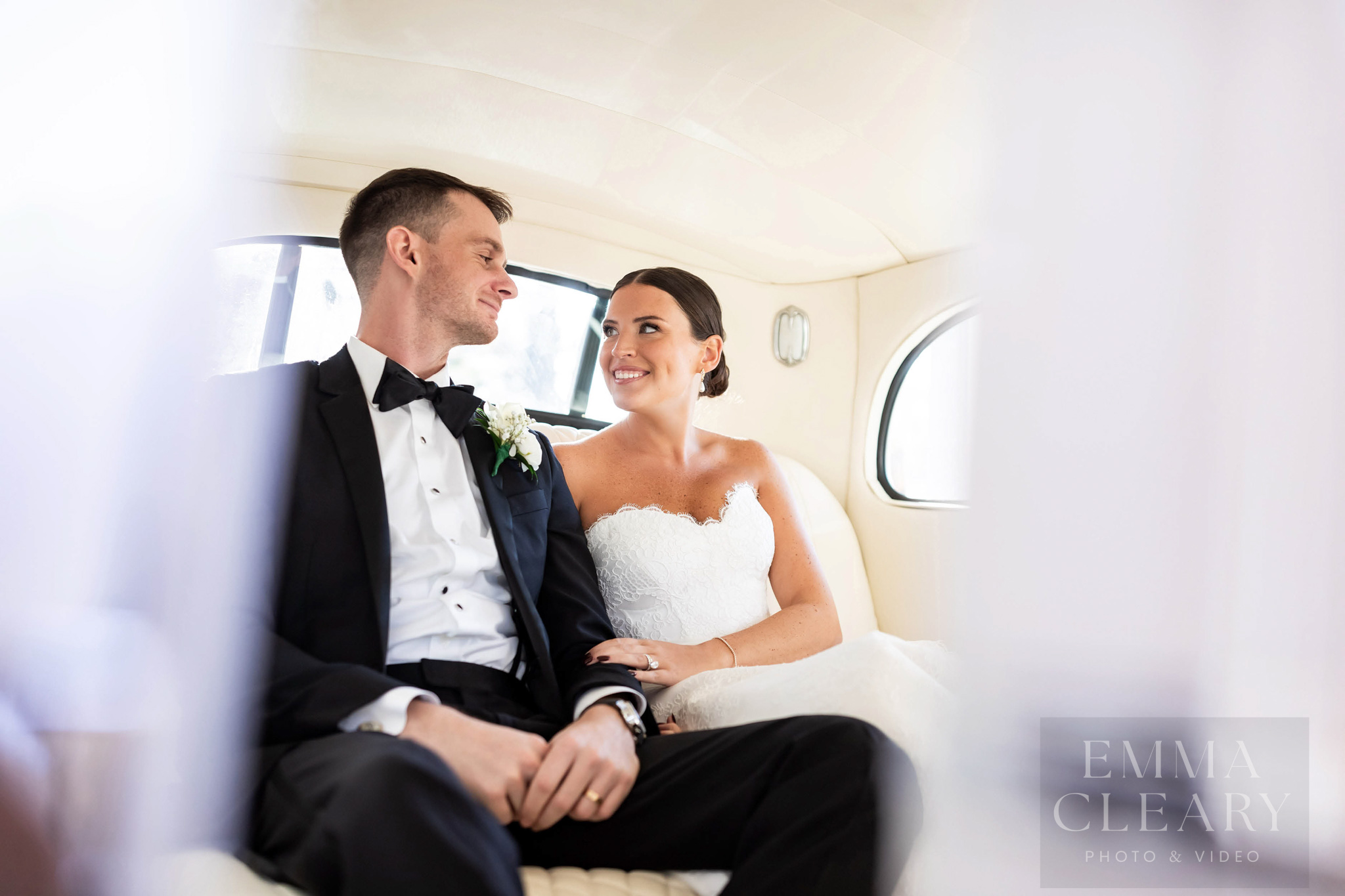Photo of a couple in a wedding car