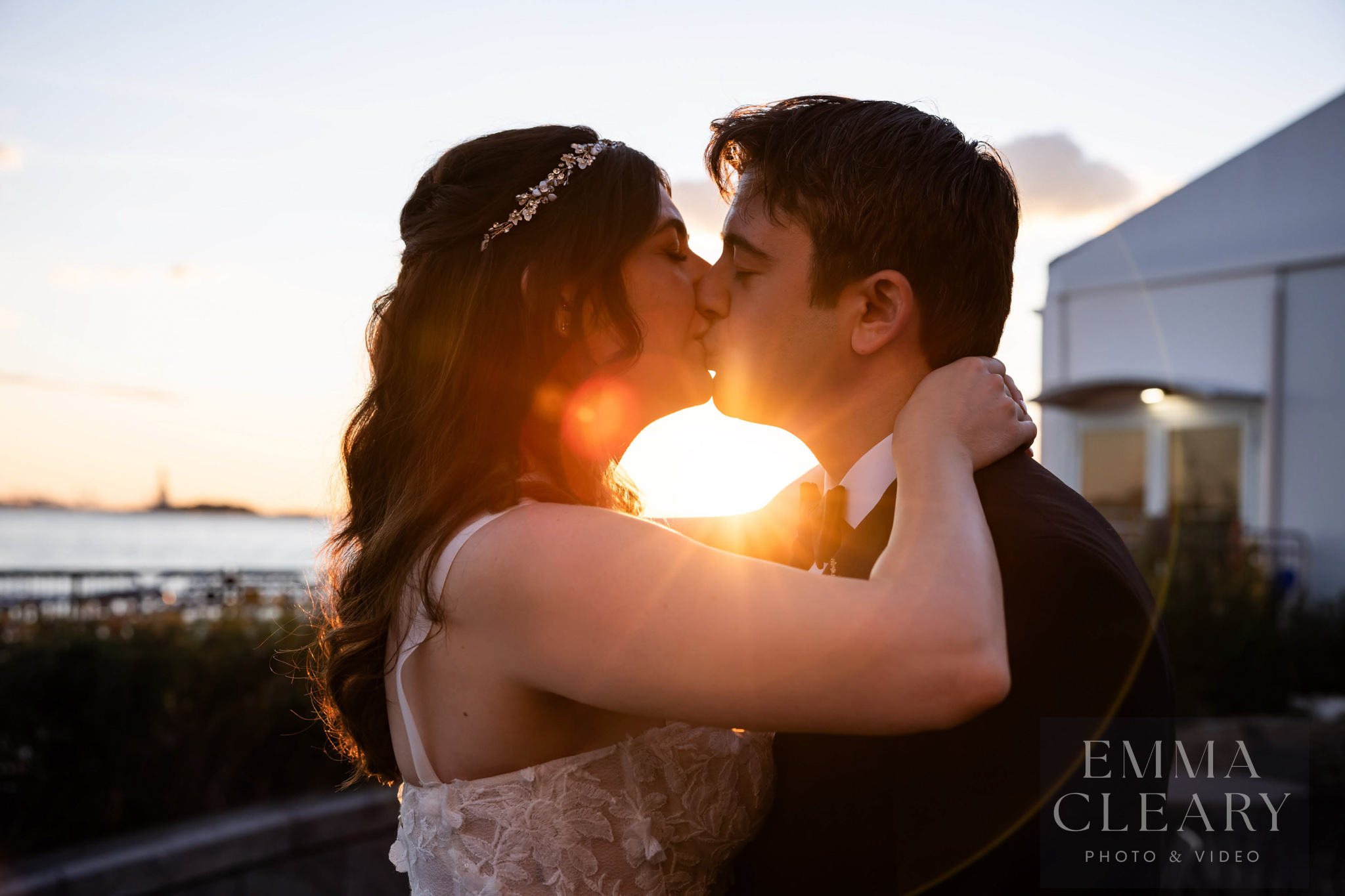 Sunset wedding kiss