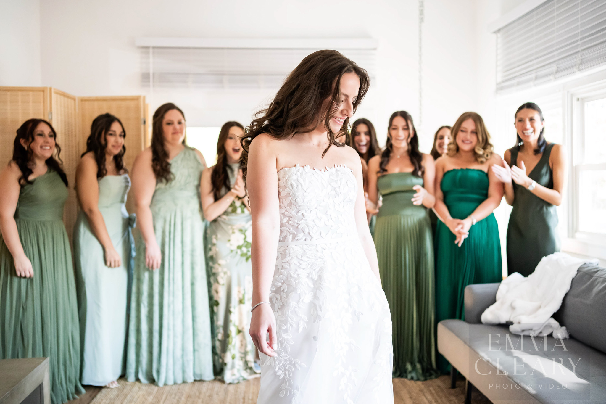 Bridesmades are surprised by the bride